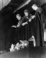 The puppeteers working the Haydn Trio marionettes on stage while on tour