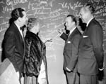 Singer and entertainer Spade Cooley signs the autograph wall