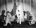 Three marionettes on stage, evidently an early effort by Harry Burnett while a student at the University of Michigan